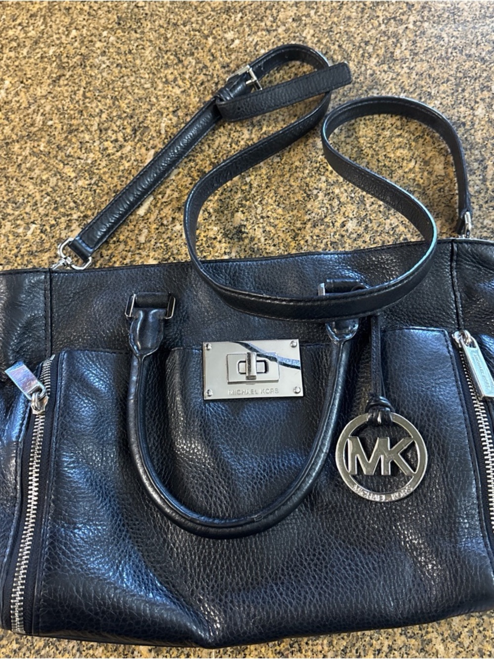 Michael Kors Black Pebbled Leather Satchel with MK Pendant
Small fray on handle